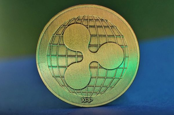 gold-xrp-coin-against-blue-and-green-background-768x509.jpg